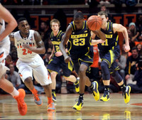 Spike Albrecht (2), Caris LeVert (23), and Nik Stauskas (11)