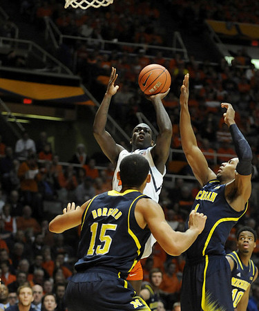 Jon Horford (15), Glenn Robinson III (1), and Derrick Walton Jr. (10)