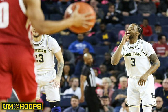 Brandon Johns Jr. (23) and Zavier Simpson (3)