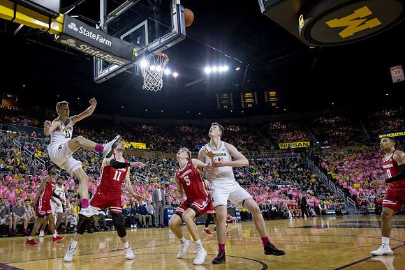 Franz Wagner (21), Isaiah Livers (2), and Jon Teske (15)