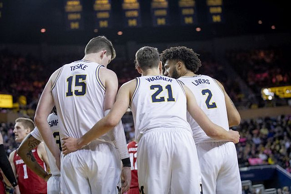 Zavier Simpson (3), Jon Teske (15), Franz Wagner (21), and Isaiah Livers (2)
