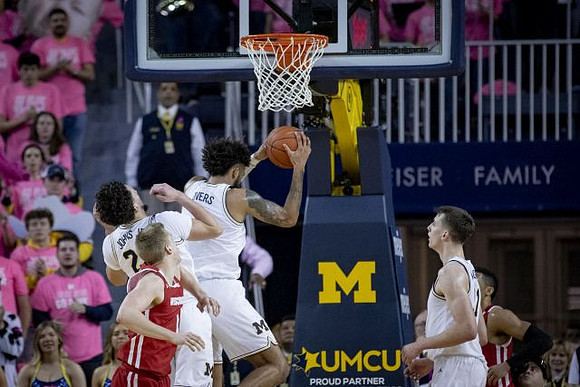 Brandon Johns Jr. (23), Isaiah Livers (2), and Franz Wagner (21)
