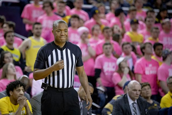 Eli Brooks (55), Howard Eisley, and Phil Martelli