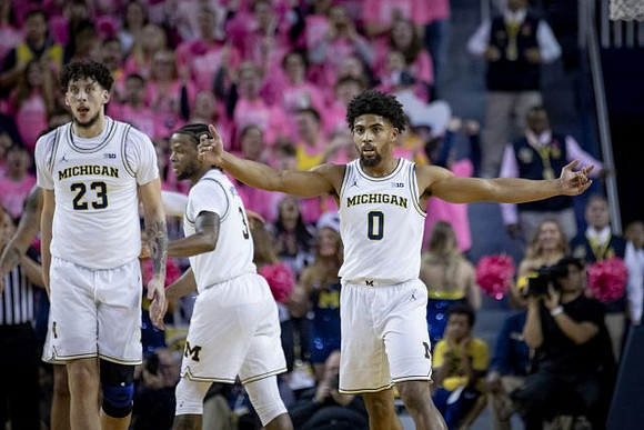Brandon Johns Jr. (23), Zavier Simpson (3), and David DeJulius (0)