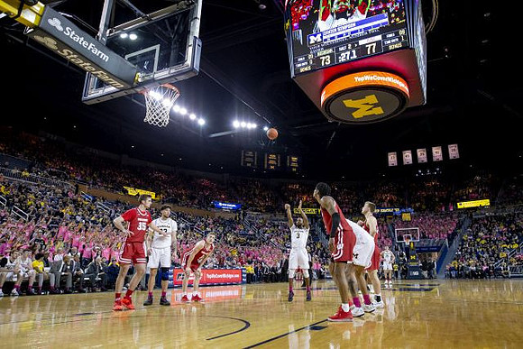 Brandon Johns Jr. (23) and Zavier Simpson (3)