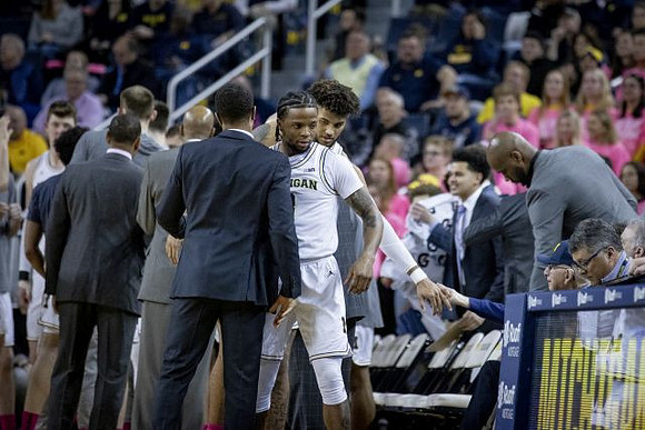 Zavier Simpson (3) and Isaiah Livers (2)