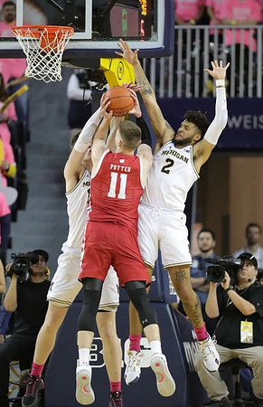 Jon Teske (15) and Isaiah Livers (2)