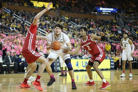 Brandon Johns Jr. (23) and Isaiah Livers (2)
