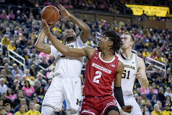 Zavier Simpson (3) and Austin Davis (51)