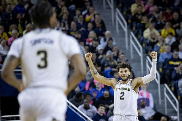Zavier Simpson (3) and Isaiah Livers (2)