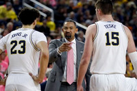 Brandon Johns Jr. (23), Juwan Howard, and Jon Teske (15)