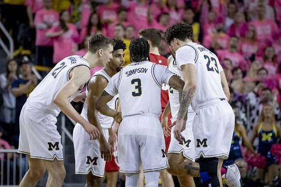 Franz Wagner (21), David DeJulius (0), Zavier Simpson (3), Isaiah Livers (2), and Brandon Johns Jr. (23)