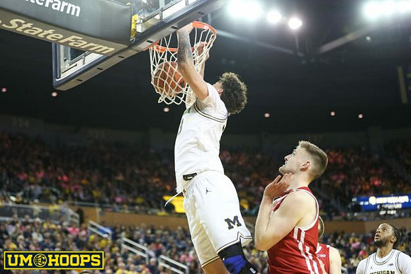 Brandon Johns Jr. (23) and Zavier Simpson (3)