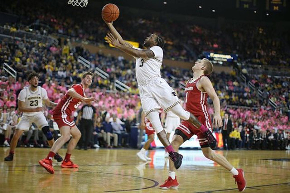 Brandon Johns Jr. (23) and Zavier Simpson (3)