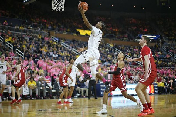 Franz Wagner (21), Zavier Simpson (3), and Isaiah Livers (2)