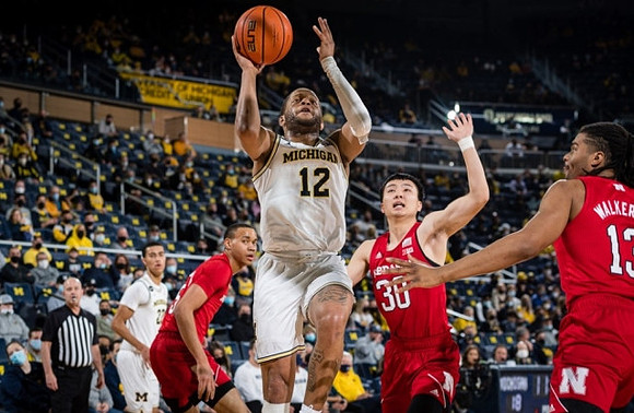 Caleb Houstan (22) and DeVante' Jones (12)