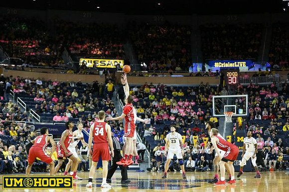 Franz Wagner (21), Jon Teske (15), Brandon Johns Jr. (23), and Zavier Simpson (3)