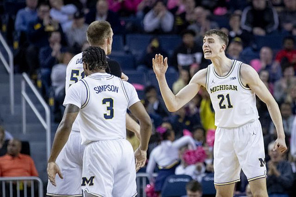 Zavier Simpson (3), Austin Davis (51), and Franz Wagner (21)