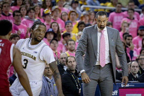 Zavier Simpson (3) and Juwan Howard
