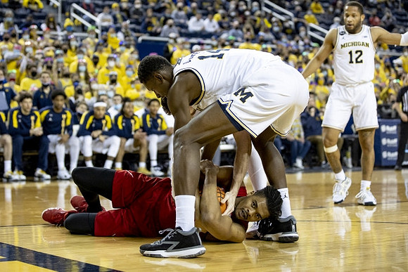 Moussa Diabate (14) and DeVante' Jones (12)