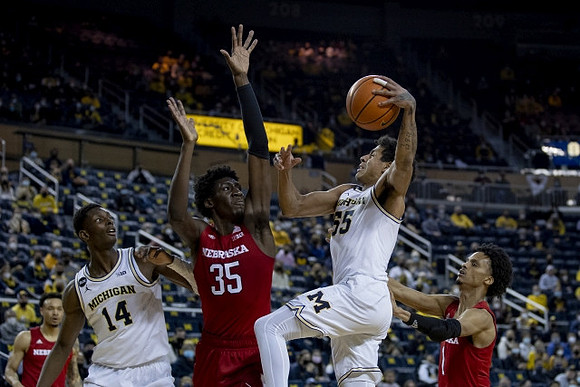 Moussa Diabate (14) and Eli Brooks (55)