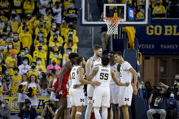 DeVante' Jones (12), Hunter Dickinson (1), Eli Brooks (55), Moussa Diabate (14), and Caleb Houstan (22)