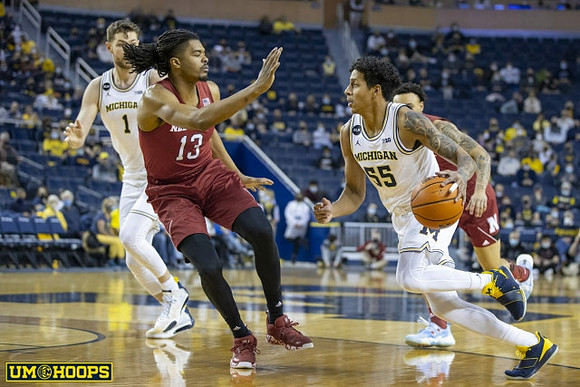 Hunter Dickinson (1) and Eli Brooks (55)