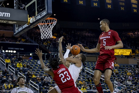 DeVante' Jones (12) and Brandon Johns Jr. (23)