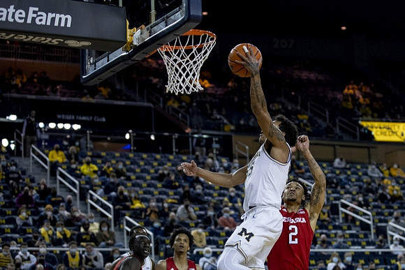 Eli Brooks (55) and Moussa Diabate (14)