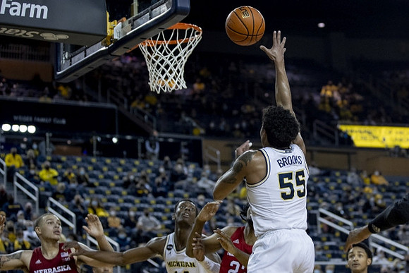 Eli Brooks (55) and Moussa Diabate (14)