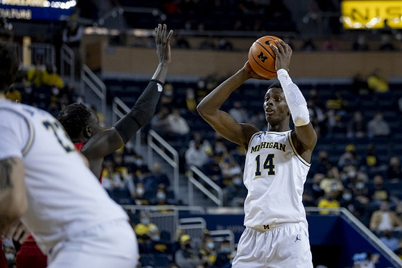 Moussa Diabate (14) and Brandon Johns Jr. (23)