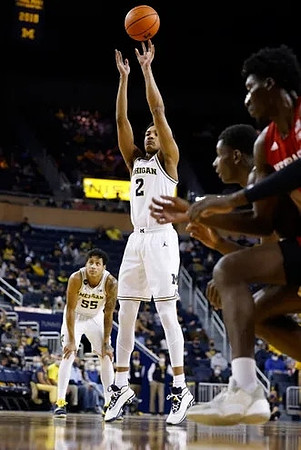 Kobe Bufkin (2) and Eli Brooks (55)