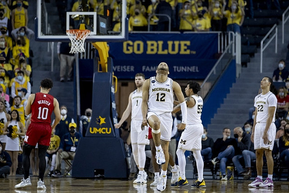 Hunter Dickinson (1), DeVante' Jones (12), Eli Brooks (55), and Caleb Houstan (22)