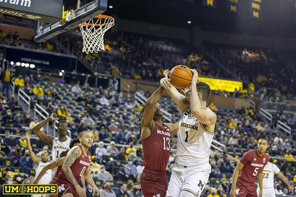 Hunter Dickinson (1), DeVante' Jones (12), Moussa Diabate (14), and Caleb Houstan (22)