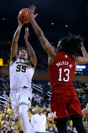 Eli Brooks (55) and Juwan Howard