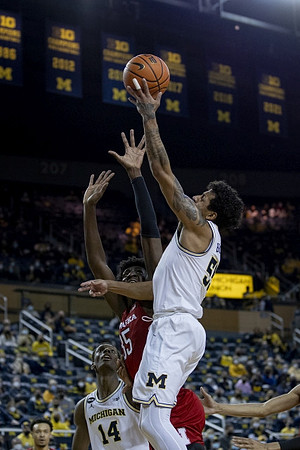 Moussa Diabate (14) and Eli Brooks (55)