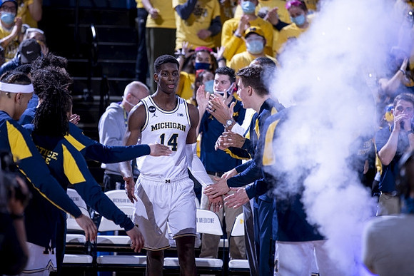 Moussa Diabate (14) and Michigan Team