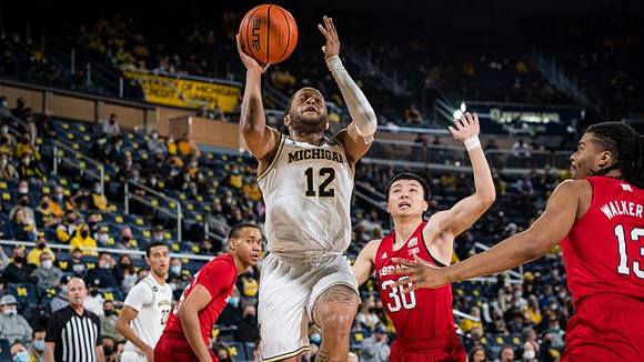 DeVante' Jones (12) and Caleb Houstan (22)