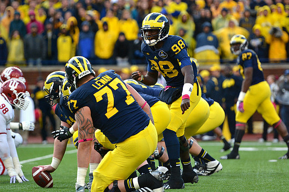 Taylor Lewan (77), Graham Glasgow (61), Devin Gardner (98), and Devin Funchess (87)