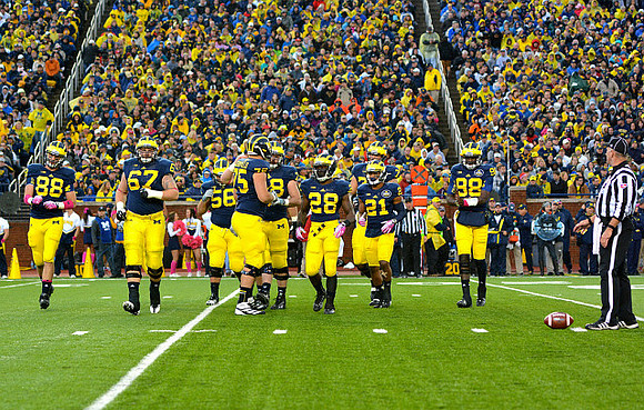 Jake Butt (88), Kyle Kalis (67), Chris Bryant (58), Michael Schofield (75), Erik Magnuson (78), Fitzgerald Toussaint (28), Jeremy Gallon (21), Taylor Lewan (77), and Devin Gardner (98)