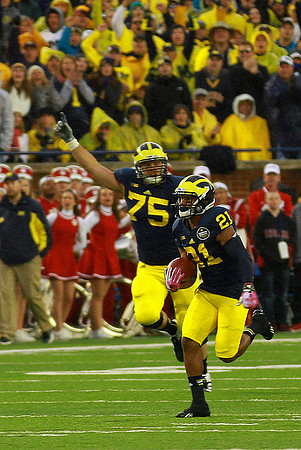 Michael Schofield (75) and Jeremy Gallon (21)