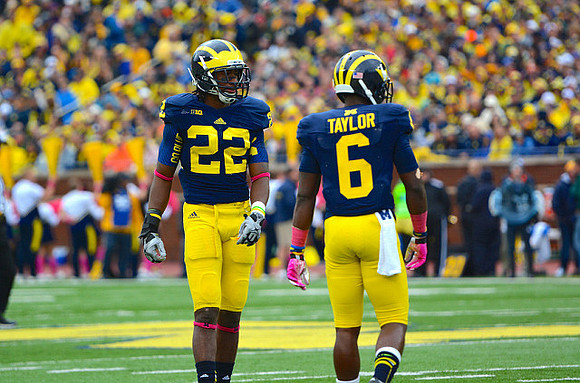 Jarrod Wilson (22) and Raymon Taylor (6)