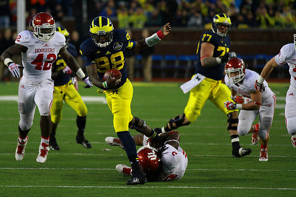 Devin Gardner (98), Fitzgerald Toussaint (28), and Taylor Lewan (77)