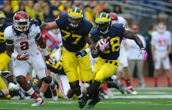 Taylor Lewan (77) and Fitzgerald Toussaint (28)
