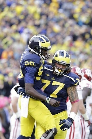 Devin Gardner (98) and Taylor Lewan (77)