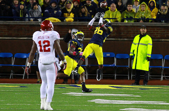 Quinton Washington (76) and Jourdan Lewis (26)
