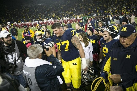 Desmond Morgan (48), Taylor Lewan (77), and Drew Dileo (9)