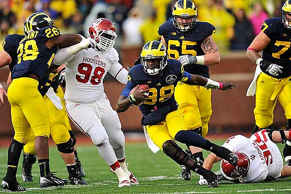 Fitzgerald Toussaint (28), Devin Gardner (98), Kyle Bosch (65), and Taylor Lewan (77)