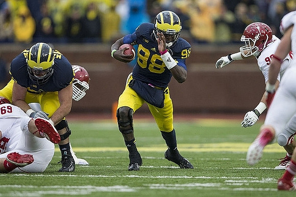 Erik Magnuson (78) and Devin Gardner (98)
