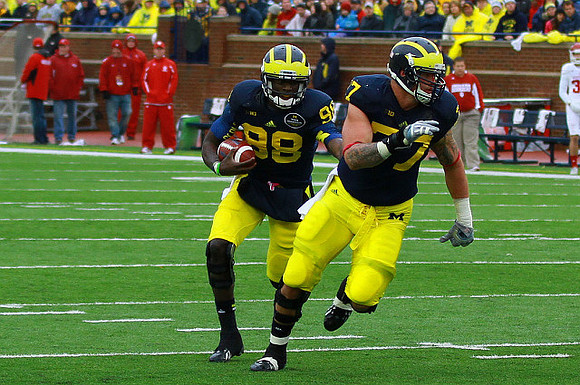 Devin Gardner (98) and Taylor Lewan (77)